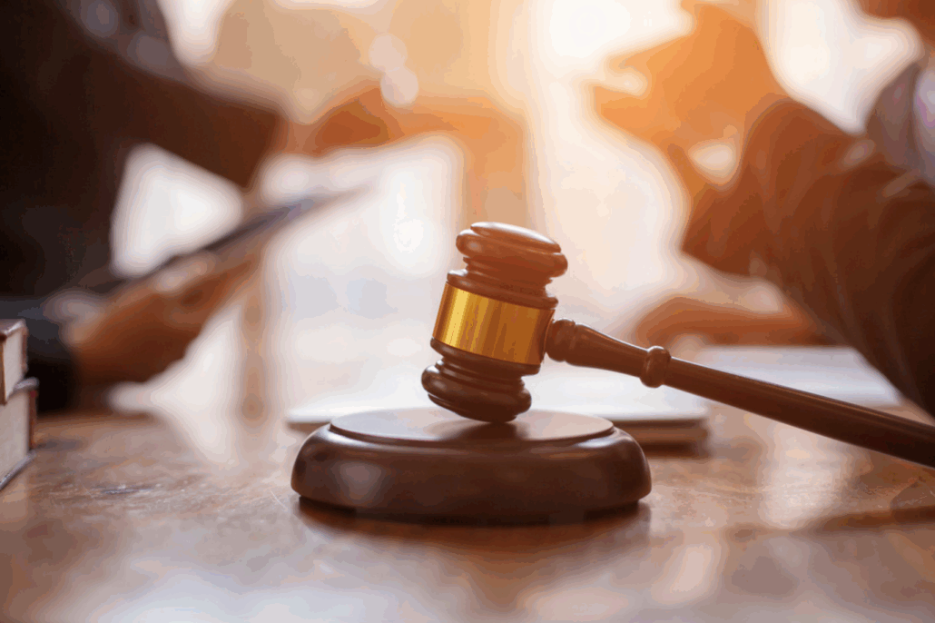 Gavel on table, legal discussion happening